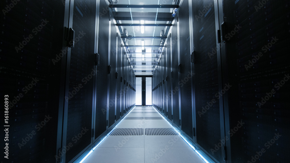 View Through Big Working Data Center with Server Racks.
