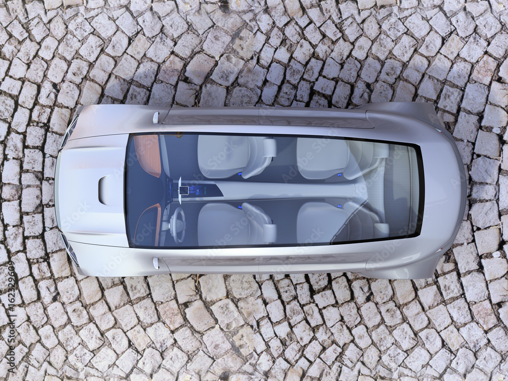 鹅卵石地面上的自动驾驶汽车俯视图。3D渲染图。