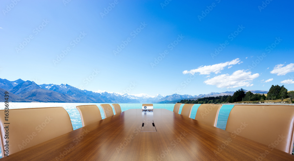 conference table with blue lake and blue sky