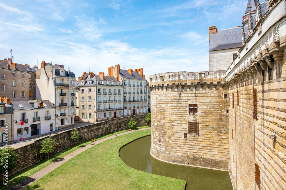 City scape view with castle wall and beautiful buildings in Nantes city during the sunny weather in 