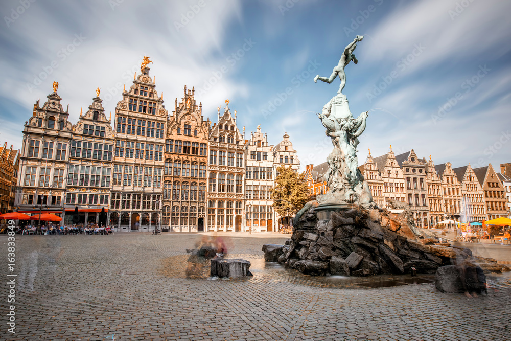 Wide angle view on the Grote Markt square with Brabo fountain in Atwerpen city, Belgium. Long exposu