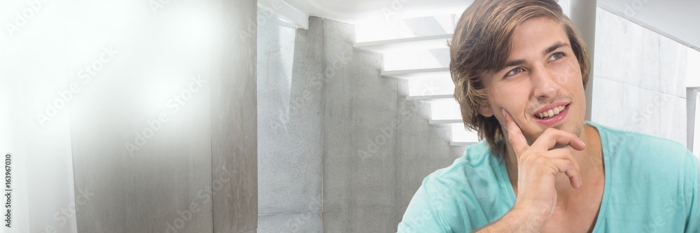 Thinking young man with minimal architectural space transition