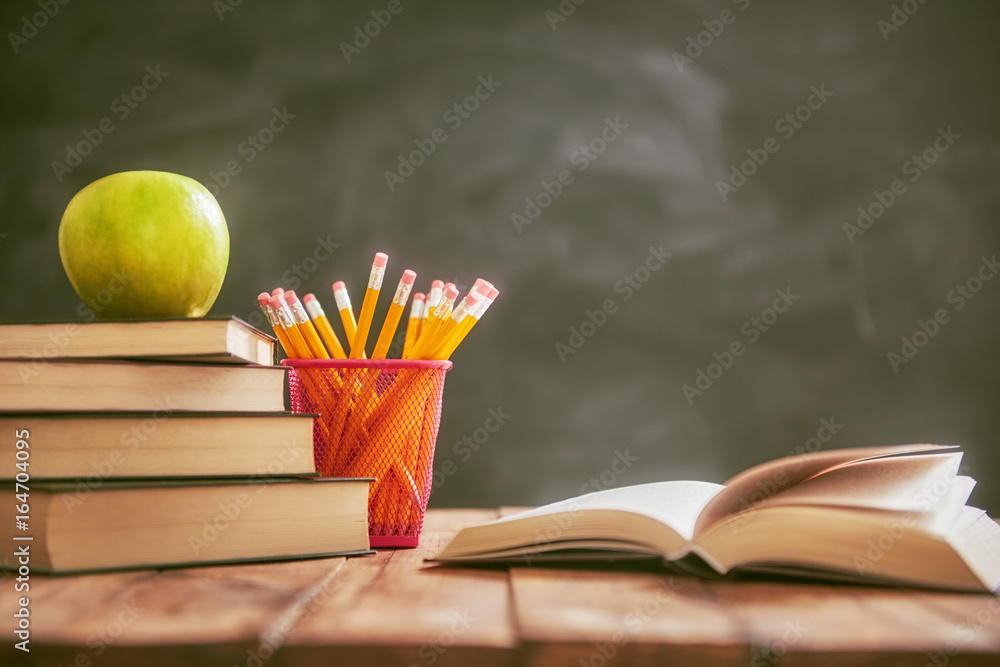 Apple and pile of books