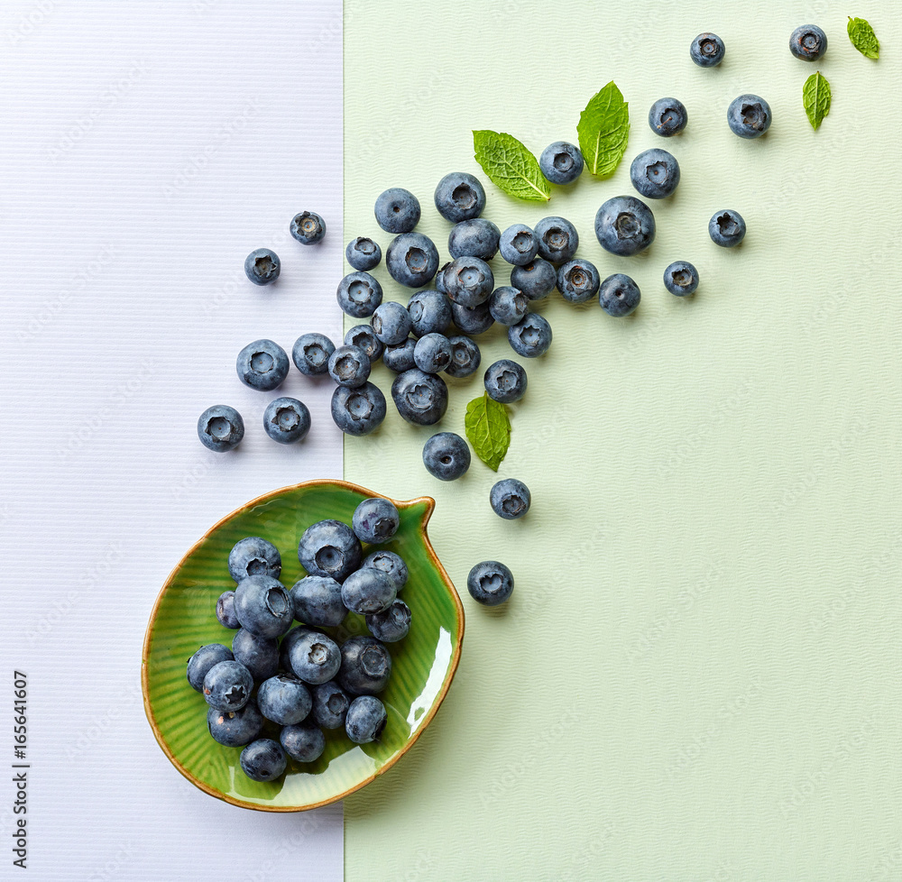 blueberries on colorful paper background