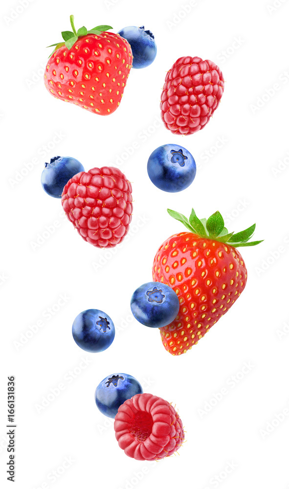 Isolated berries in the air. Falling strawberry, raspberry and blueberry fruits isolated on white ba