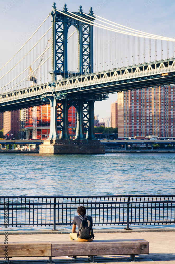 Man enjoying the Manhattan Bridge view in New York