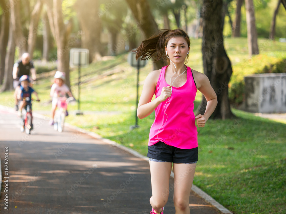 Woman fitness outdoor concept, young asian beautiful woman/sport girl running walking at outdoor par