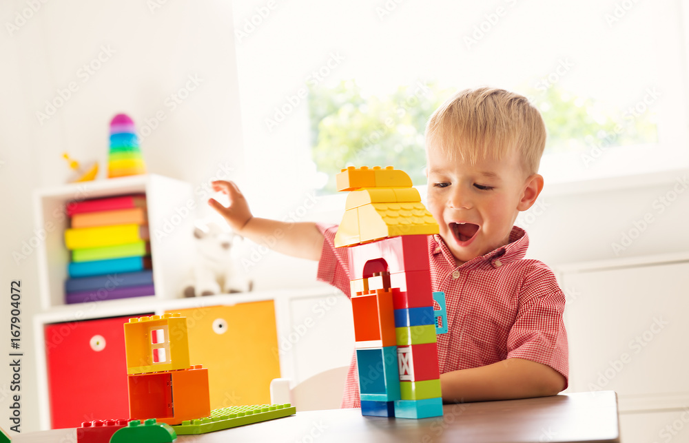Little child playing with blocks