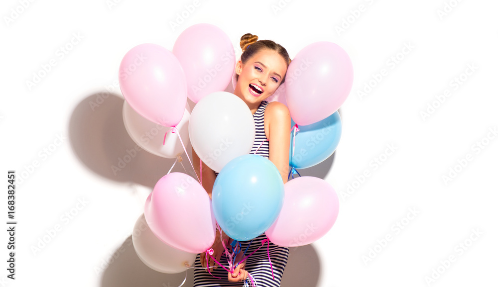 Beauty joyful teenage girl with colorful air balloons having fun isolated on white