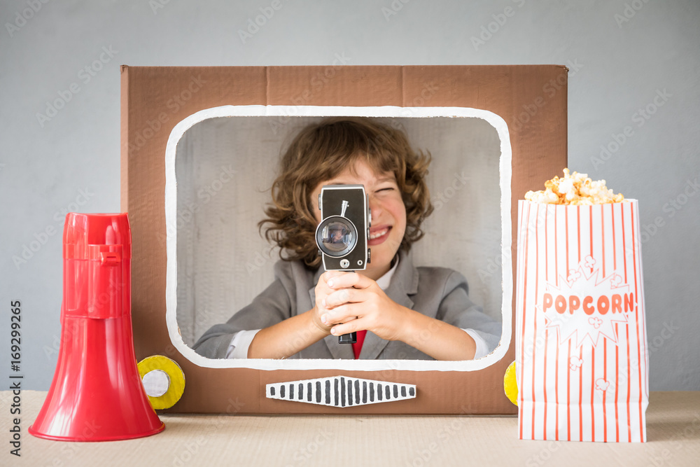 Child playing with cartoon TV