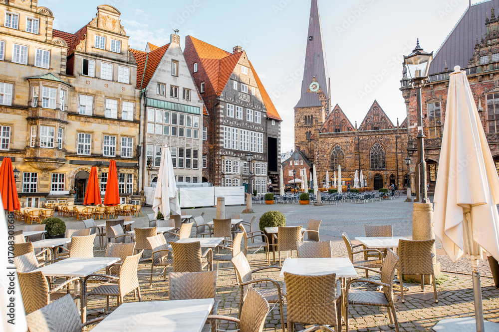 View on the Market square with cafe terrace and Our Lady church during the morning light in Bremen c