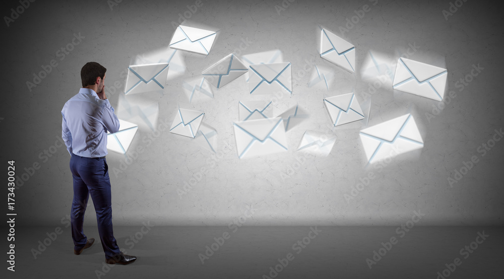 Businessman using email interface on a wall 3D rendering