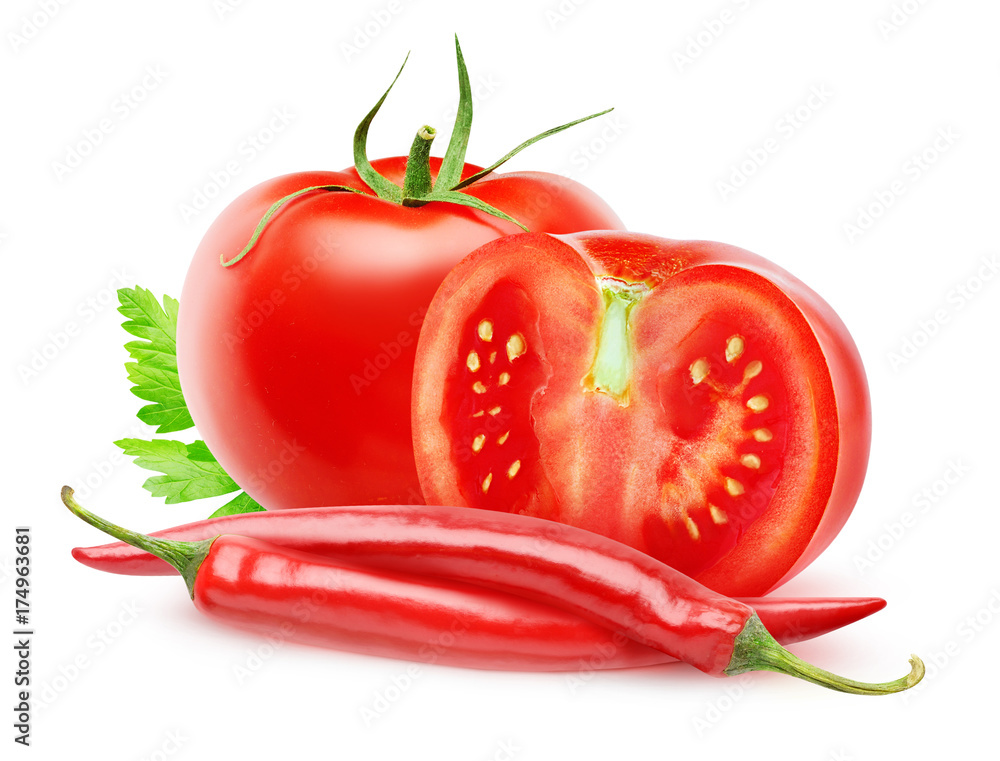 Isolated vegetables. Fresh cut tomatoes and chili peppers (hot sauce ingredients) isolated on white 
