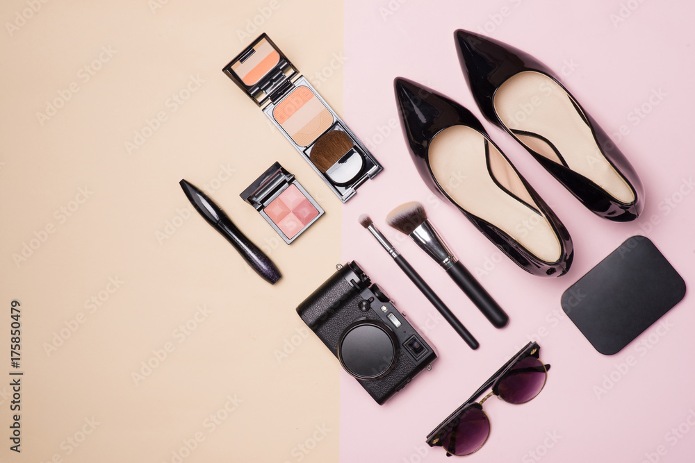 A collection of make up cosmetic beauty with camera and shoes on light color background