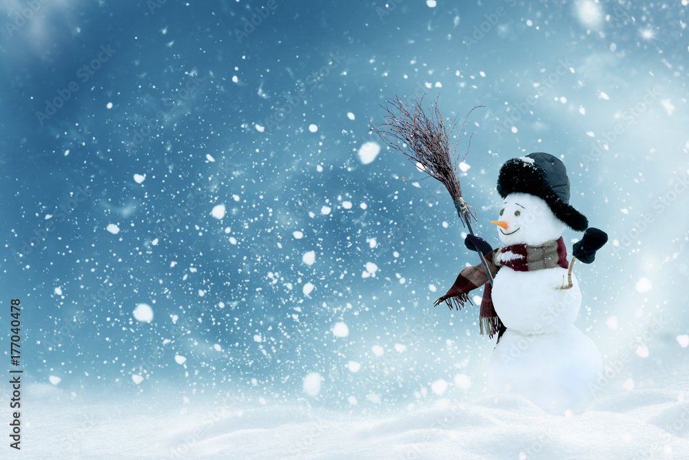 Merry christmas and happy new year greeting card with copy-space.Happy snowman standing in winter ch