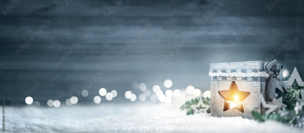 Christmas wood background with lantern, fir branches and lights