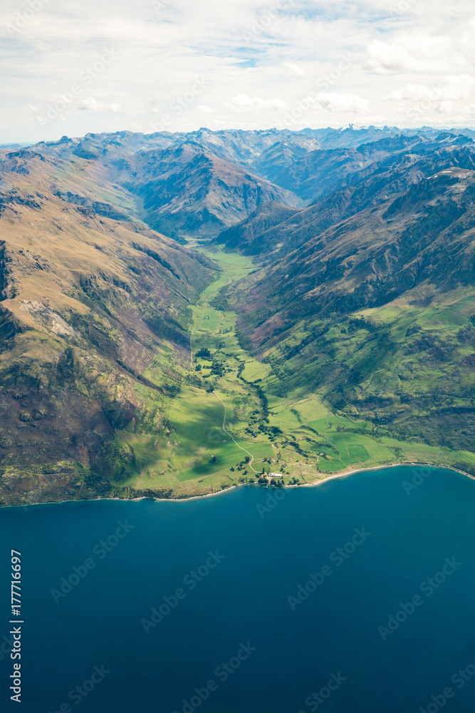 Aerial view of mountain ranges and lake landscape