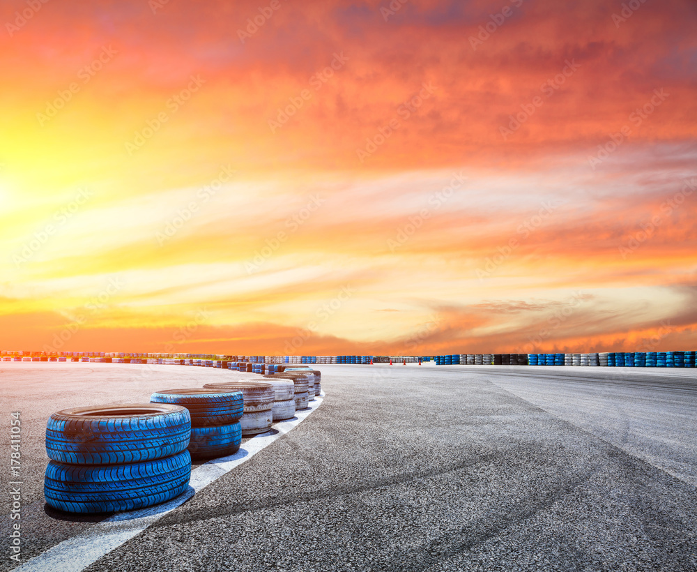 Asphalt road circuit and sky sunset with car tire brake