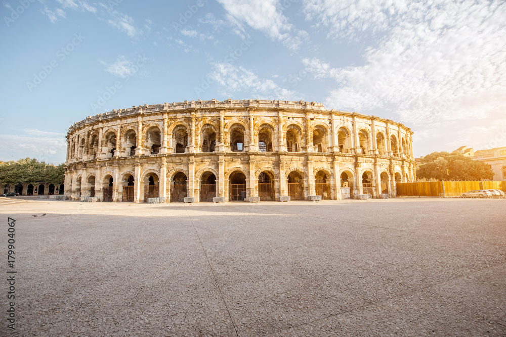 Morning view on the ancient Roman amphitheatre in Nimes city in the Occitanie region of southern Fra