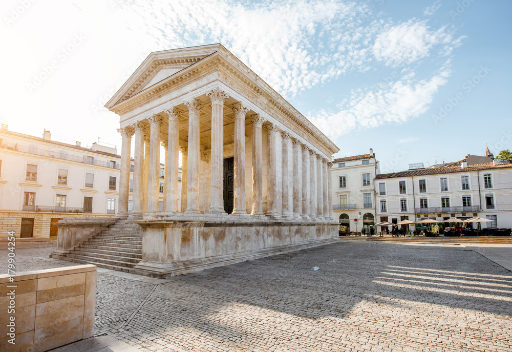 View on the ancient Roman temple Maison Carree during the sunny morning in Nimes in the Occitanie re