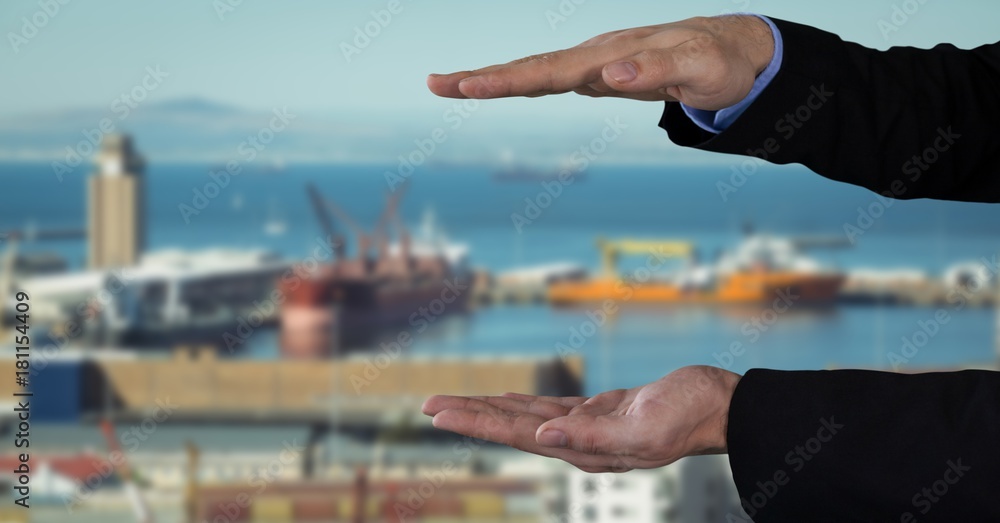 Businessman with hands palm open in city port harbor