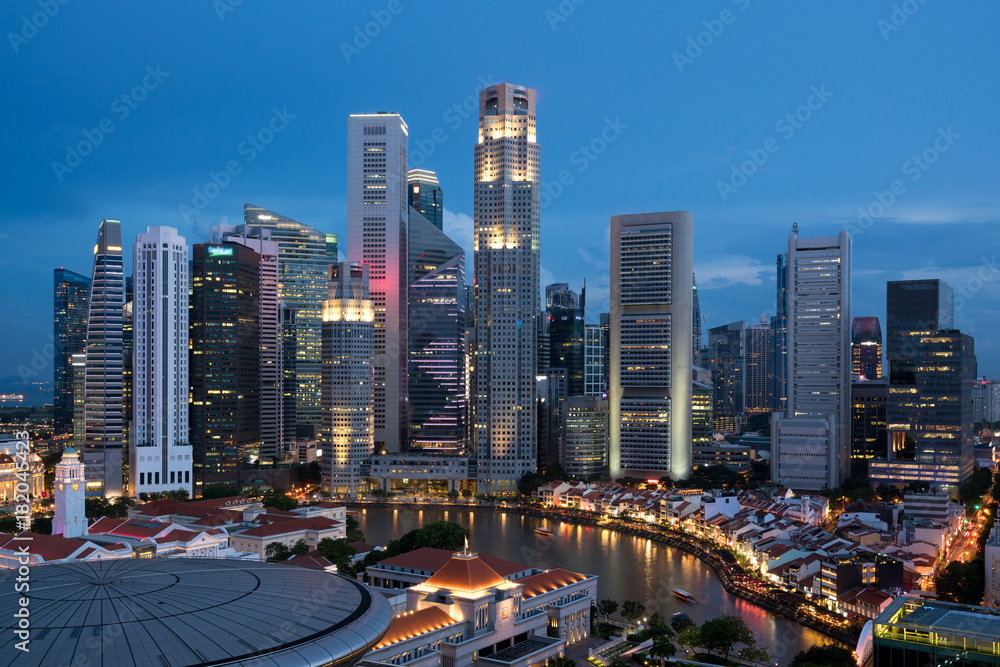 Aerial view of Singapore business district and city at night in Singapore, Asia.