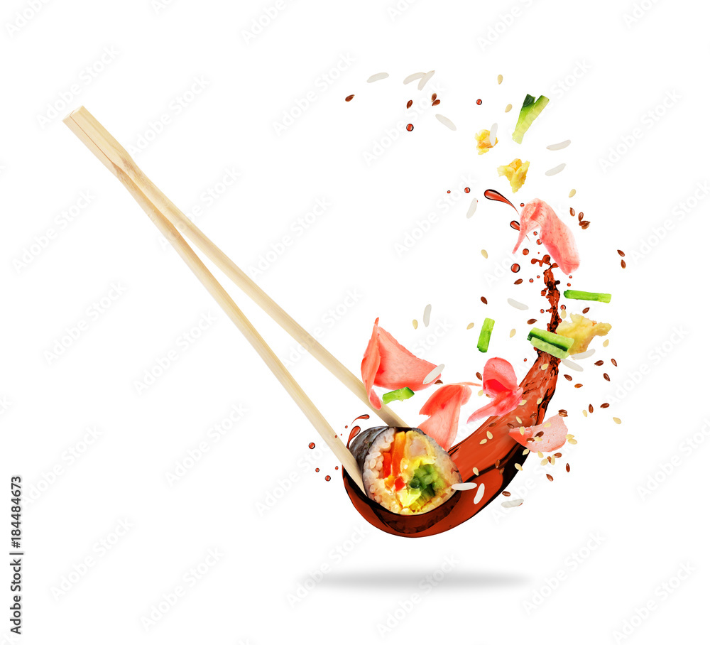 夹在筷子之间的一块寿司，上面撒着酱油，隔离在白色背景上