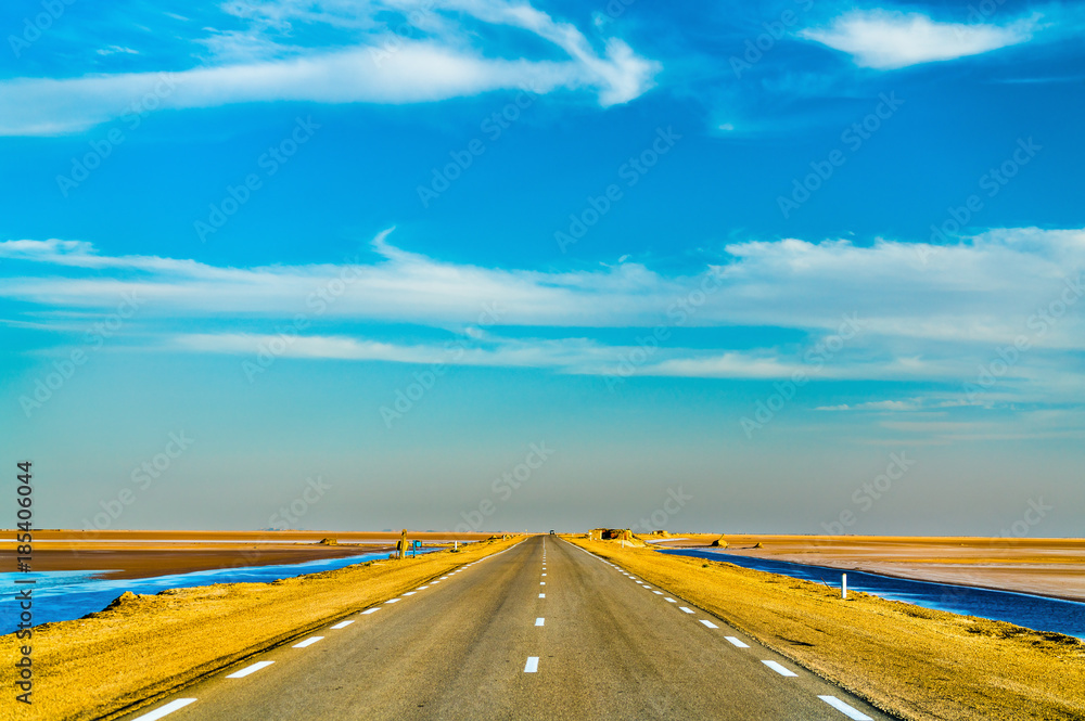 Highway through Chott el Djerid, a dry lake in Tunisia