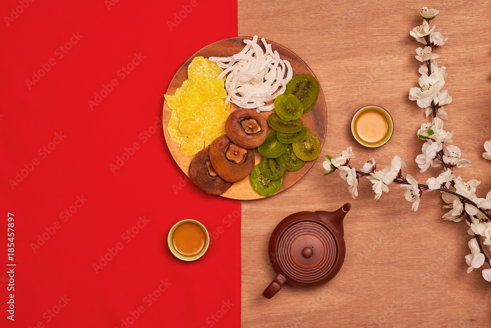 Conceptual flat lay Chinese New Year food and drink still life. Text appear in image: Prosperity, sp