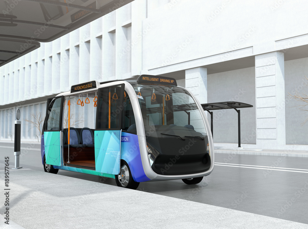 Self-driving shuttle bus waiting at bus station. The bus station equipped with solar panels for elec