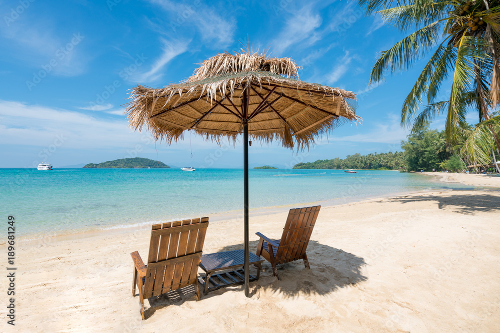 Beach Chairs and Umbrella on summer island in Phuket, Thailand. Summer, Travel, Vacation and Holiday