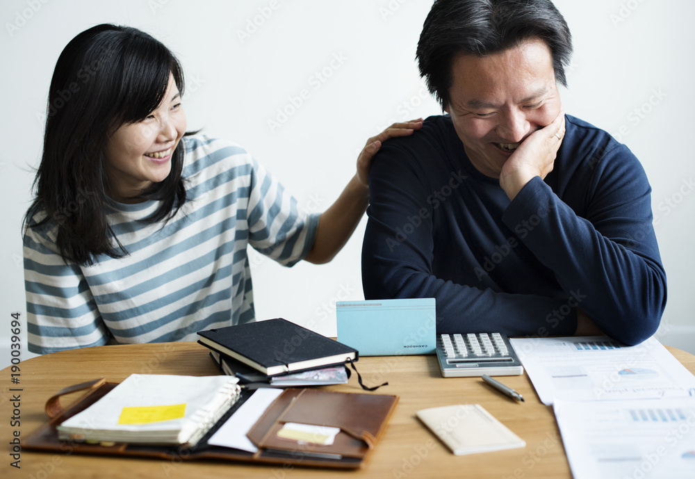 Asian couple planning for the investment