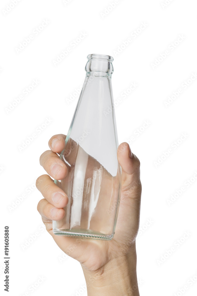 Womans hand holding empty glass bottle transparent on white background, File contains a clipping pa