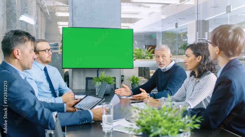 Diverse Group of Successful Business People in the Conference Room with  Green Screen Chroma Key TV 