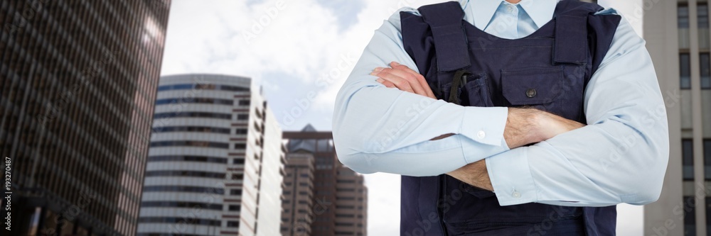 Composite image of mid section of security officer standing with
