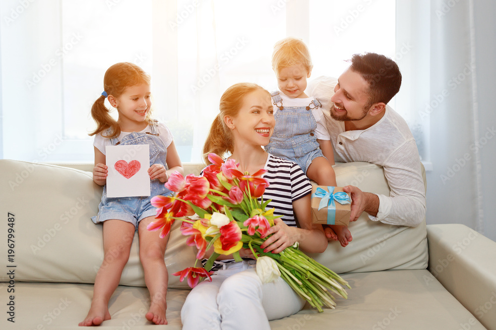 happy mothers day! father and children congratulate mother on holiday  .