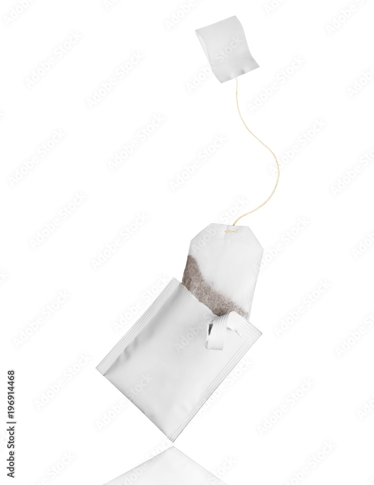 Tea bag flies out of the package on a white background