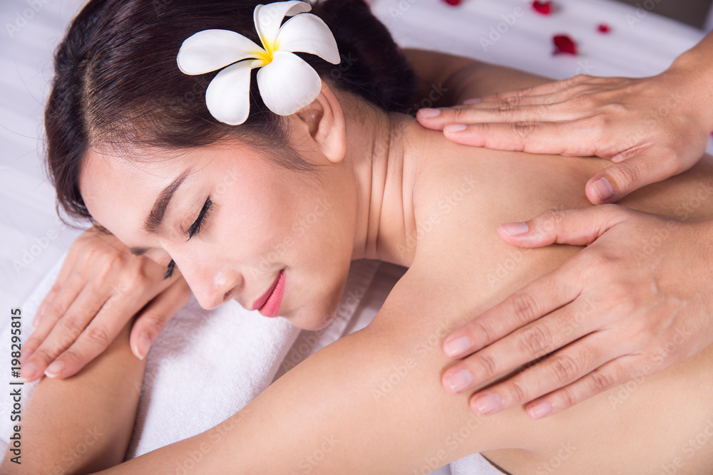 Asian lady relax with masage and spa in resort, this photo can use for skin care, spa, massage, heal