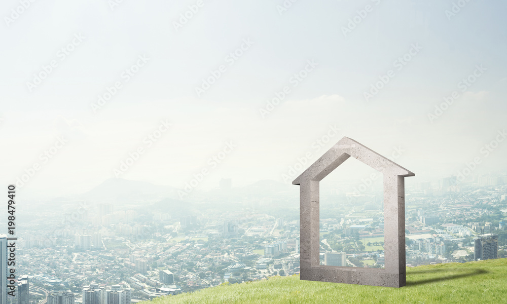 山丘上的混凝土住宅标志和背景的自然景观的概念图像