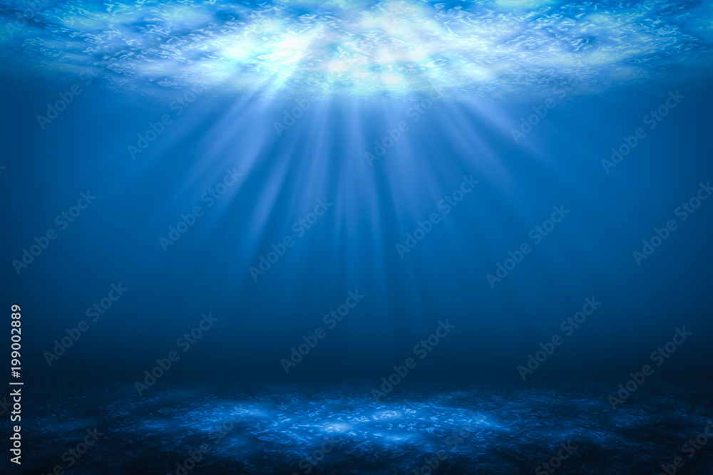 太阳光束抽象海洋中的水下背景。