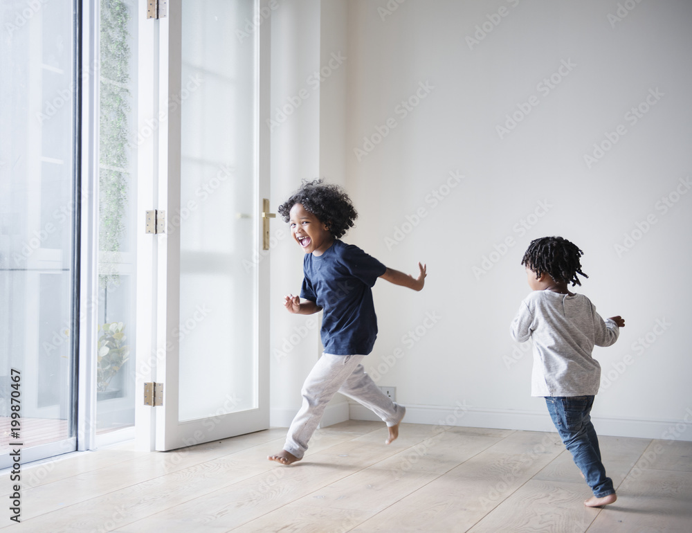 Young black boys polaying in their new house