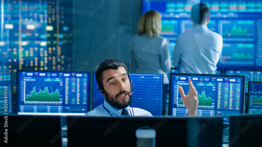 Stock Exchange Trader Makes a Deal with Big Client Over the Headset. He Works with Other Brokers and
