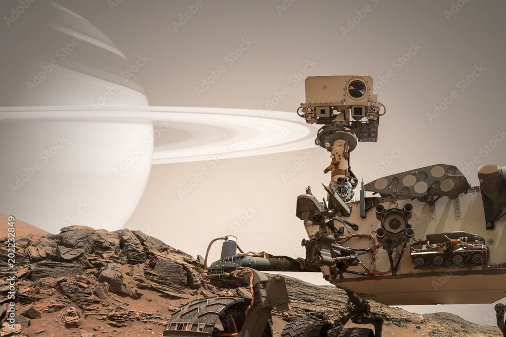 好奇号火星车探索这颗红色星球的表面。这张图片的元素由美国国家航空航天局提供。