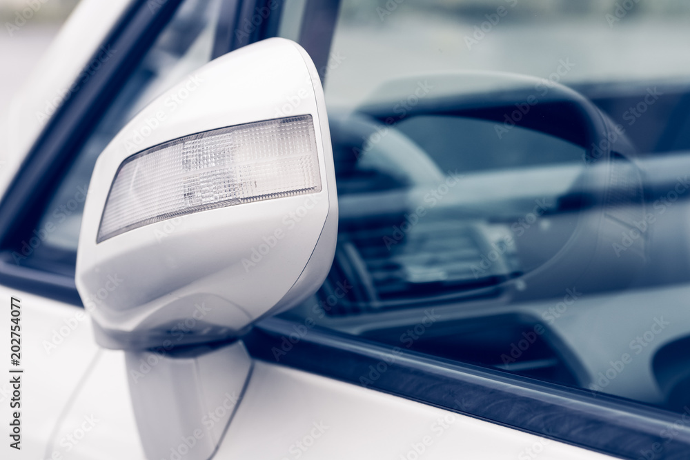 Close- up white car mirror