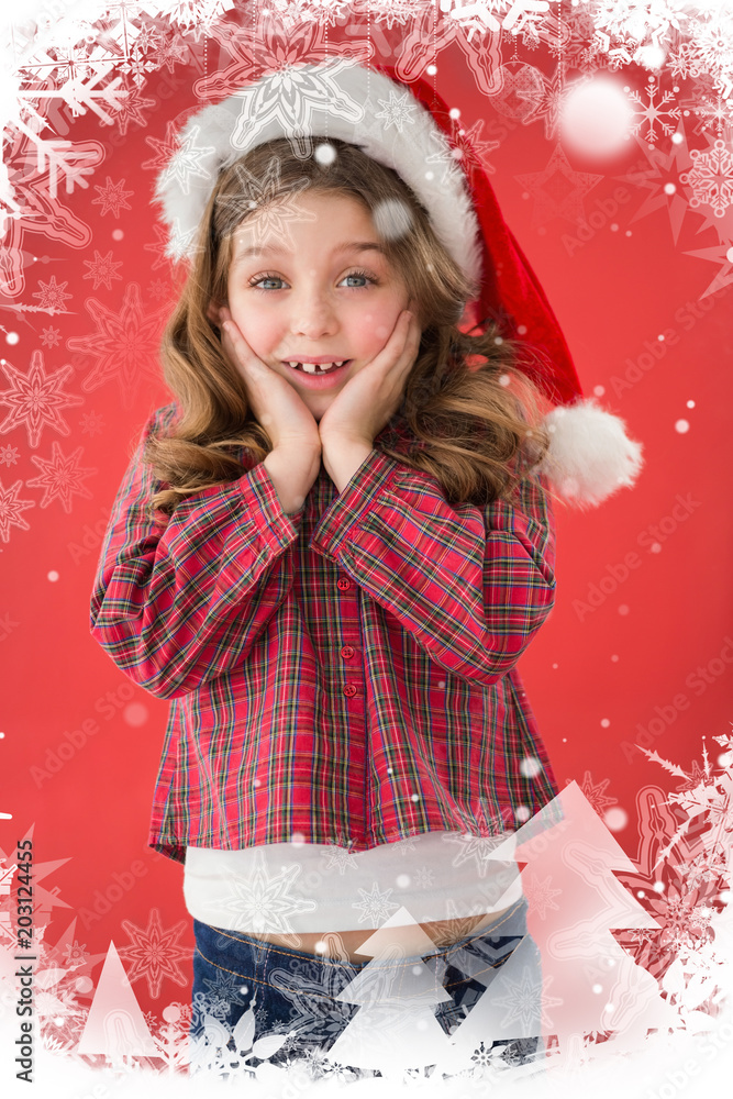 Festive little girl smiling at camera against christmas theme frame in silver