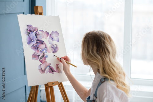 artist lifestyle. painting hobby. woman drawing beautiful watercolor floral design