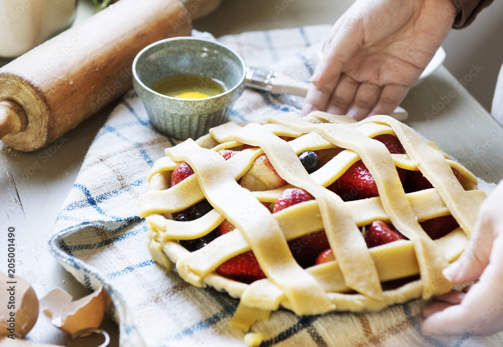 A person baking fruit pie food photography recipe idea