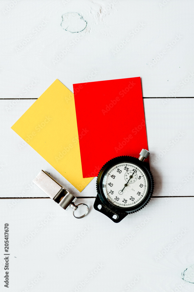 red and yellow cards on wooden background top view