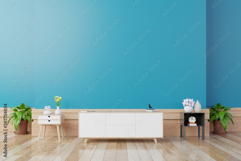 现代客厅的电视柜，蓝色墙壁背景上有桌子、花草，3d渲染