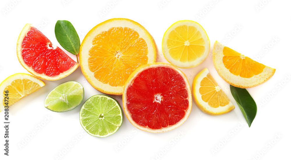 Slices of fresh citrus fruits on white background